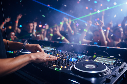 DJ hands on turntables at party